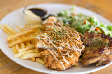 Fried pork chop, boiled potatoes and vegetable salad