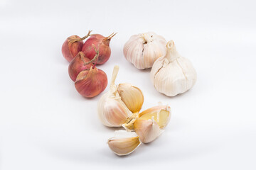 Onions, shallots, garlic and white onion on a white background