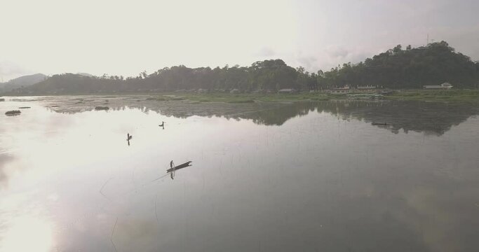 Bright Morning Over The Mountains With Reflections On The Water Surface In Loktak Lake, Moirang, Manipur, Northeast India.  - aerial drone