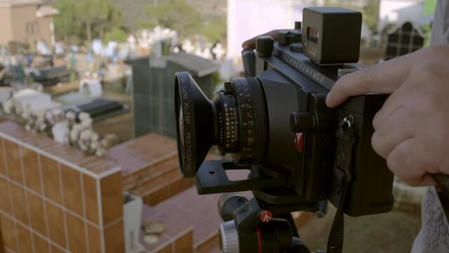 Photographer takes a picture at the Maya cemetery in Zinacantan in Chiapas, Mexico.