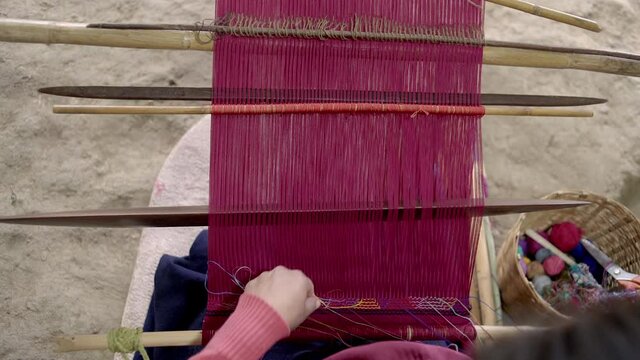 Maya woman weaving traditional clothing in Zinacantan in Chiapas, Mexico.