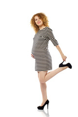Cute caucasian adult pregnat woman in striped dress