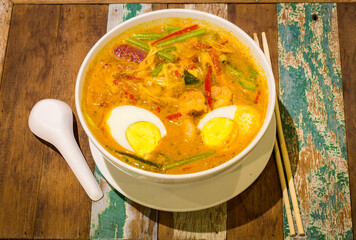 prawn mee, prawn noodles on wooden