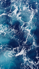 Background of the sea surface, foam stains on clean fresh ocean water. Vertical photo aerial view