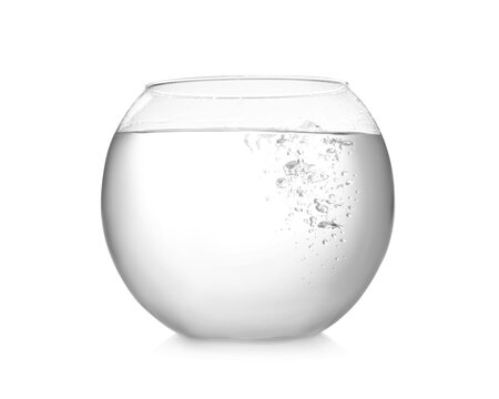Round fish bowl filled with water on white background