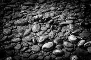 Wet pebbles on beach