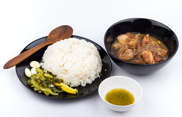 Stewed pork leg with pickled mustard greens and rice on white background