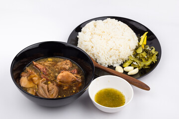 Stewed pork leg with pickled mustard greens and rice on white background