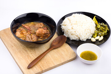 Stewed pork leg with pickled mustard greens and rice on white background