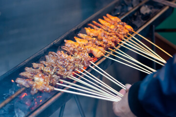 lamb and chicken satay on the grill
