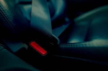 Car seat belt with red press button. Fasten seatbelt for safety and security and protect life from...