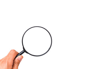 Male hand holds a magnifying glass on a white background