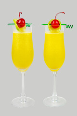 two yellow cocktail isolated background.