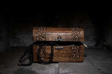 Wooden trunk with treasures and plants. Property of pirates. Mystery wooden box. 