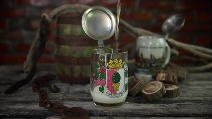 Pouring beer in traditional German stein with a silver lid. Slow motion video 60fps