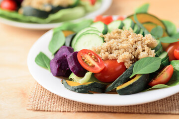 Salad quinoa with vegetables on plate, Healthy vegan food	