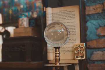 Forecast crystal ball Over magic books.