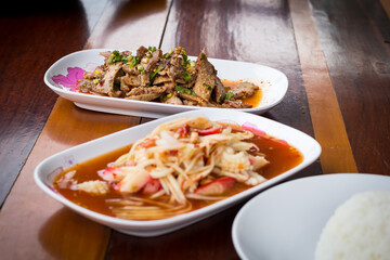 Thai food name is Grilled pork with spicy salad, Thai food