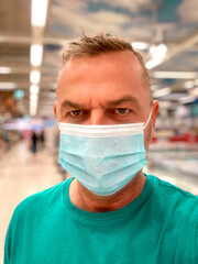 Man doing his shopping wearing a face mask