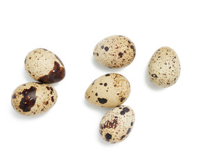round raw quail eggs isolated on white background
