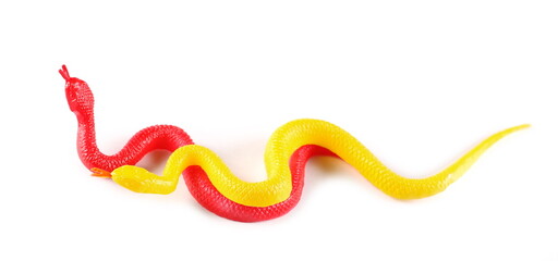 Colorful rubber snakes, toys isolated on white background, top view