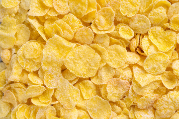 Corn flakes bowl sweets on gray cement background, top view flat lay layout design, fresh and healthy breakfast concept.