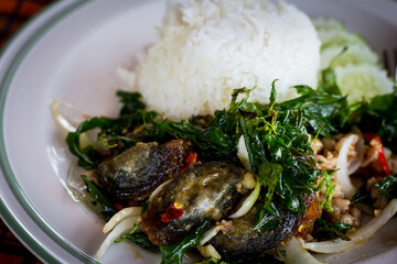  STIR FRIED CRISPY BASIL WITH PORK AND BLACK PRESERVED EGGS