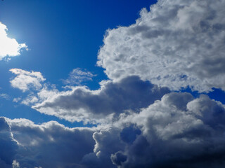 dramatic blue sky with clouds and sun rays