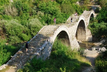 The traditional three-arched stone-made bridge Kalogeriko at Kipoi village, one of the 45 villages known as Zagoria or Zagorochoria in Epirus region of southwestern Greece, August 9 2010.