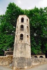 Fototapeta na wymiar The traditional stone-made belfry of Saint Vlasios of Megalo Papigko village, one of the 45 villages known as Zagoria or Zagorochoria in Epirus region of southwestern Greece