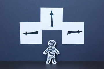 Choice concept, paper man and drawn arrows.