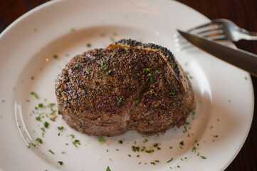 Steak. Grass-fed skirt steak, grilled to a medium rare and served with a garlic herb butter sauce and paired with roasted potatoes and Brussels sprouts. Classic American steakhouse favorite.