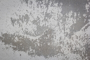 Background texture of the old cracked wall with peeling paint and plaster