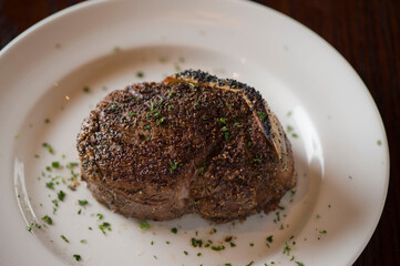 Steak. Grass-fed skirt steak, grilled to a medium rare and served with a garlic herb butter sauce and paired with roasted potatoes and Brussels sprouts. Classic American steakhouse favorite.