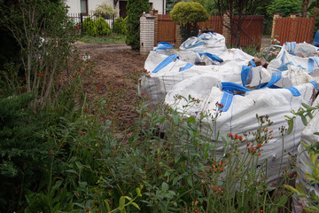 paving stones in transport bags in the yard of a country house
