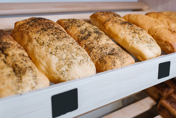 Fresh crispy bread on a store shelves or bakery