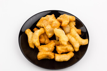 Deep-fried doughstick def and screw pine (Thailand breakfast) on white background.