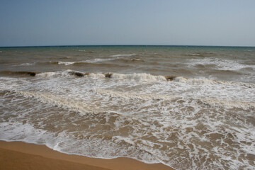 Fototapeta na wymiar waves and sand on the beach