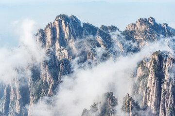Clouds by the mountain peaks of Huangshan National park.