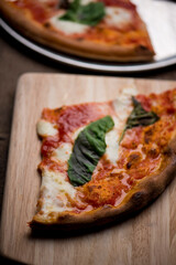 Pizza. Traditional New York City style margarita pizza pie with a thin homemade crispy crust, fresh tomato garlic marinara sauce topped with buffalo mozzarella cheese and fresh basil leaves.