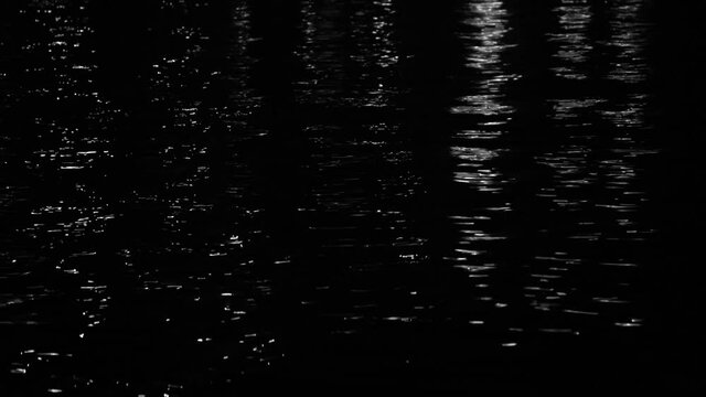 Beautiful dramatic dark black night sea water abstract video background.