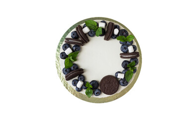 Birthday Drip Cake with fresh  mint, marshmallows and and berries (raspberries, blueberries).