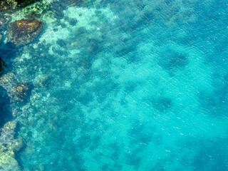 Turquoise sea water from above