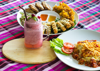 Thai-style Hors d'oeuvres and Blueberry smoothie and Spaghetti Bolognese on loincloth