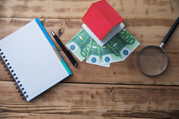 house model and money with notepad