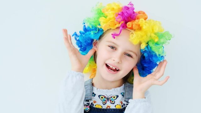 School child in colorful wig
