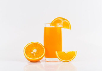 Orange juice and slices of orange on white background