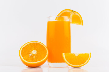 Orange juice and slices of orange on white background