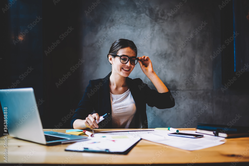 Aufkleber cheerful professional architect in optical spectacles working on new startup project sitting at desk