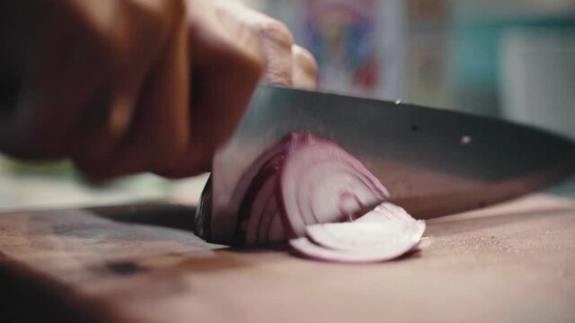 Chef Cutting Red Onion